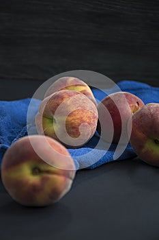 Peaches on a dark background. View from above. Space for text