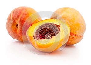 Peaches half and whole isolated on white background