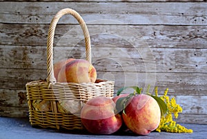 Peaches in a light wicker basket