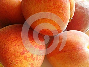 Peaches are in reddish color five in number