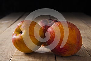 Peaches on a old wooden table