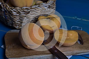 Peaches, seasonal fruit in a wicker bowl