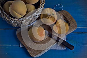 Peaches, seasonal fruit in a wicker bowl