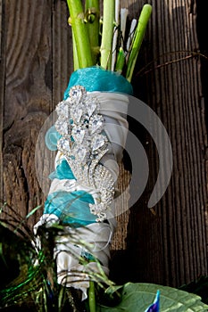 Peacock Wedding Bridal Bouquet on Wood Background