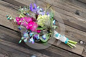 Peacock Wedding Bridal Bouquet on Wood Background