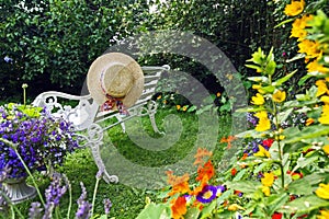 Peacuful summer garden with a hat