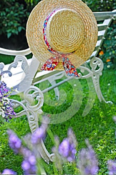 Peacuful summer garden with a hat