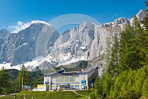 On peak of Dachstein and view alpine mountains