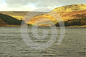 Peak District sunset glowing on the slopes of the Dovestone Resevoir.