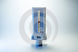 Peak flow meter, medical device that measures the maximum rate of exhalation of a person to monitor lung function and breathing.