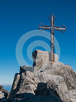 The peak of the highest mountain in Slovakia, Gerlachovsky Stit, on which a cross rises