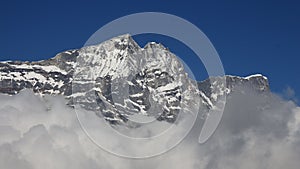 Peak of Kongde Ri surrounded by clouds