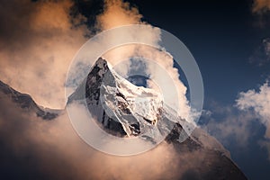 Peak of Mount Kangtega in Himalaya mountains at sunset, Nepal photo