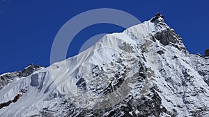 Peak of mount Kongma Tse covered by glacier