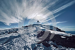 Peak pyramid of Jebel Toubkal with unusual hairy clouds formations