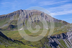 peak of Sandhubel mountain in blue sky near Arosa in summer