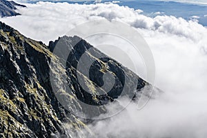 The peak is surrounded by clouds. High Tatras, Slovakia