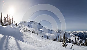 The peak of Whistler Mountain on a sunny day.