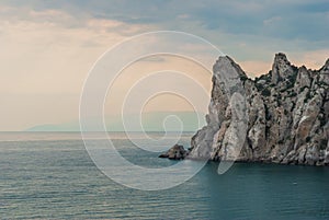 Peaked rock in sea