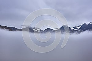 Peaks in the clouds on Grossglockner alpine pass