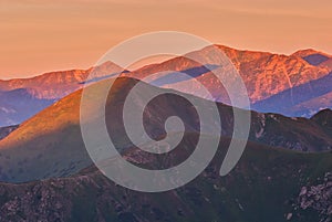 Peaks of Liptovske Kopy during sunrise from Hladky Stit mountain in High Tatras