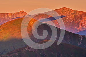 Peaks of Liptovske Kopy during sunrise from Hladky Stit mountain in High Tatras