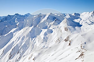 The peaks of the mountain range in winter Alps