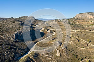 Peaks of a rocky mountain in the arid countryside , Europe, Greece, Peloponnese, Argolis, Nafplion, Myrto seashore, in summer on a