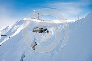 peaks of snow-capped mountains in winter