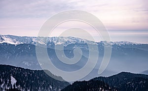 peaks of snow-capped mountains in winter