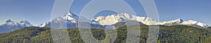 Peaks of the Tantalus Range at the southern end of the Coastal Mountains of British Columbia, Canada against blue sky