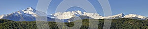 Peaks of the Tantalus Range at the southern end of the Coastal Mountains of British Columbia, Canada against blue sky