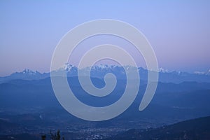 Snow Covered peak view from Kausani town in Uttarakhand, India photo