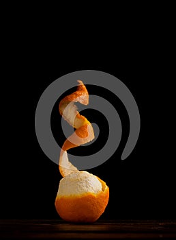 Pealed orange over black background