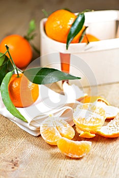 Pealed satsuma on wooden table