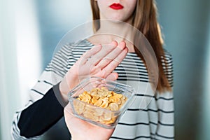 Peanut allergy concept - food intolerance. Young girl refuses to eat peanuts