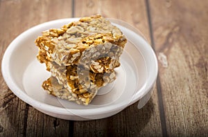 Peanut brittle or peanut chikki and roasted groundnuts photo