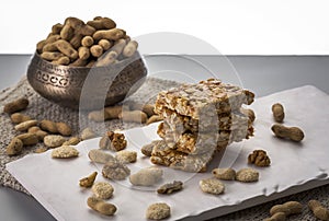 Peanut brittle or peanut chikki and roasted groundnuts photo