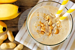 Peanut-butter banana oat smoothie close up, downward view photo