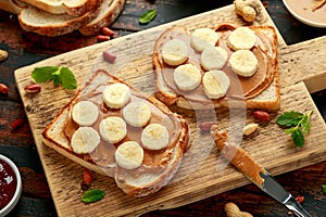 Peanut Butter and banana Sandwich on wooden board. morning breakfast