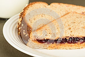 Peanut butter and jelly sandwich on wheat bread