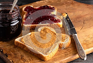Peanut Butter and Jelly Sandwich on a Wooden Kitchen Counter
