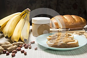 Peanut butter, loaf, banana . Breakfast with peanut butter. Healthy snack - vegetarian bread loaf with peanut butter and