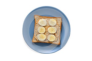 Peanut butter toast with banana slices isolated on white