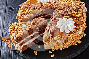 Peanut cake topped with cream, close up