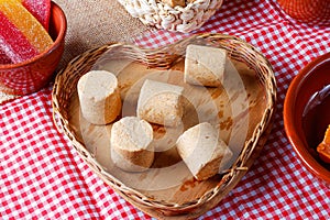 Peanut candy paÃ§oca or pacoca traditional Brazilian sweet based on peanuts on a rustic wooden table