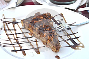 Peanut cake slice on a dessert plate