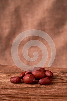 peanut hill Deep fried peanuts over rustic wicker background. emptiness place. Space for text. copyspace