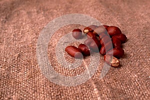 peanut hill Deep fried peanuts over rustic wicker background. emptiness place. Space for text. copyspace