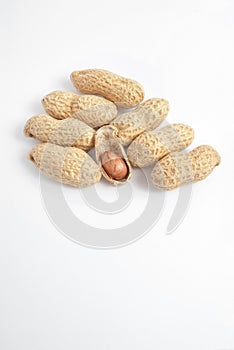Peanut kernel with shells on white